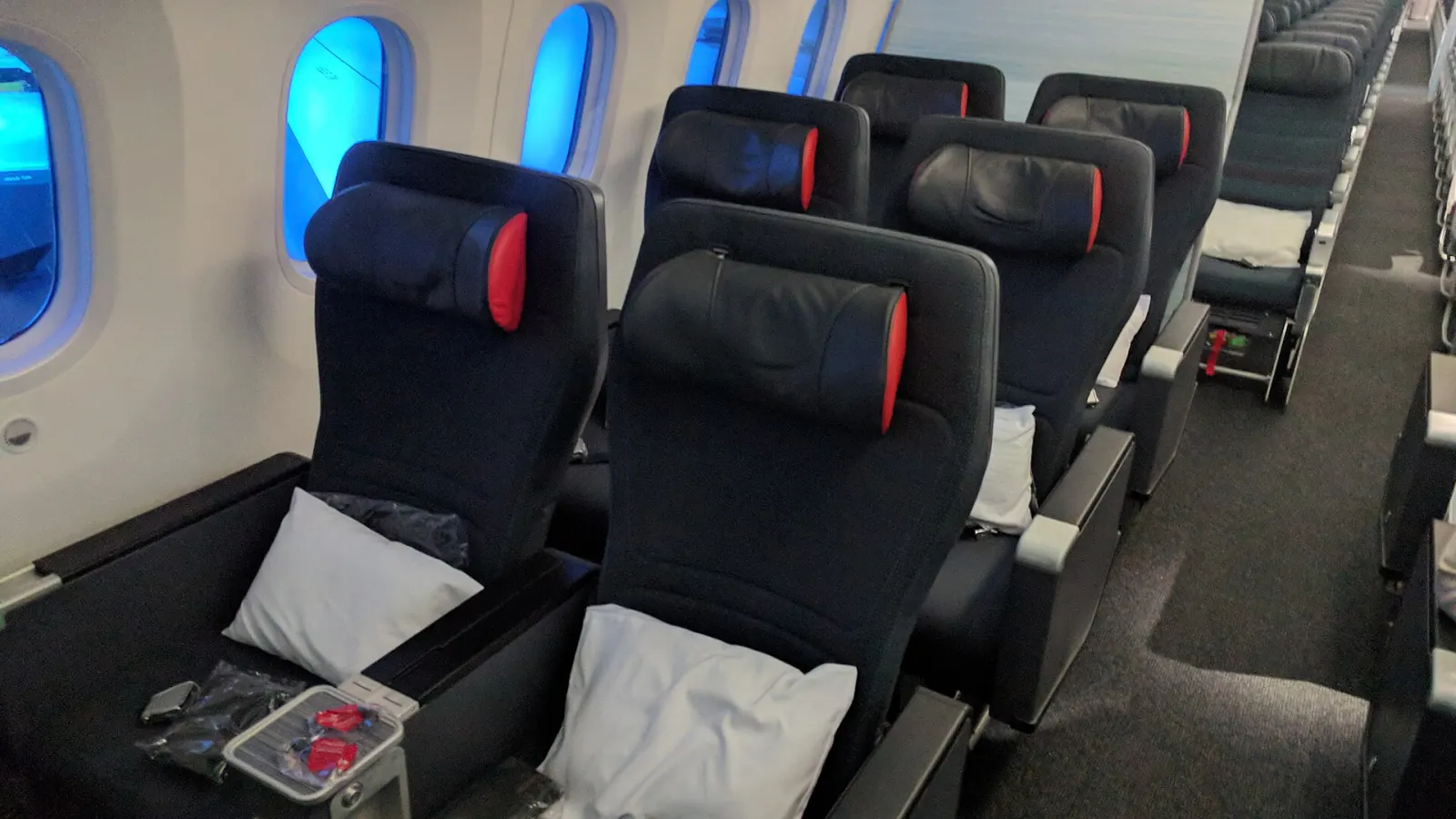 Premium economy seats beside the windows of a Boeing 787 cabin