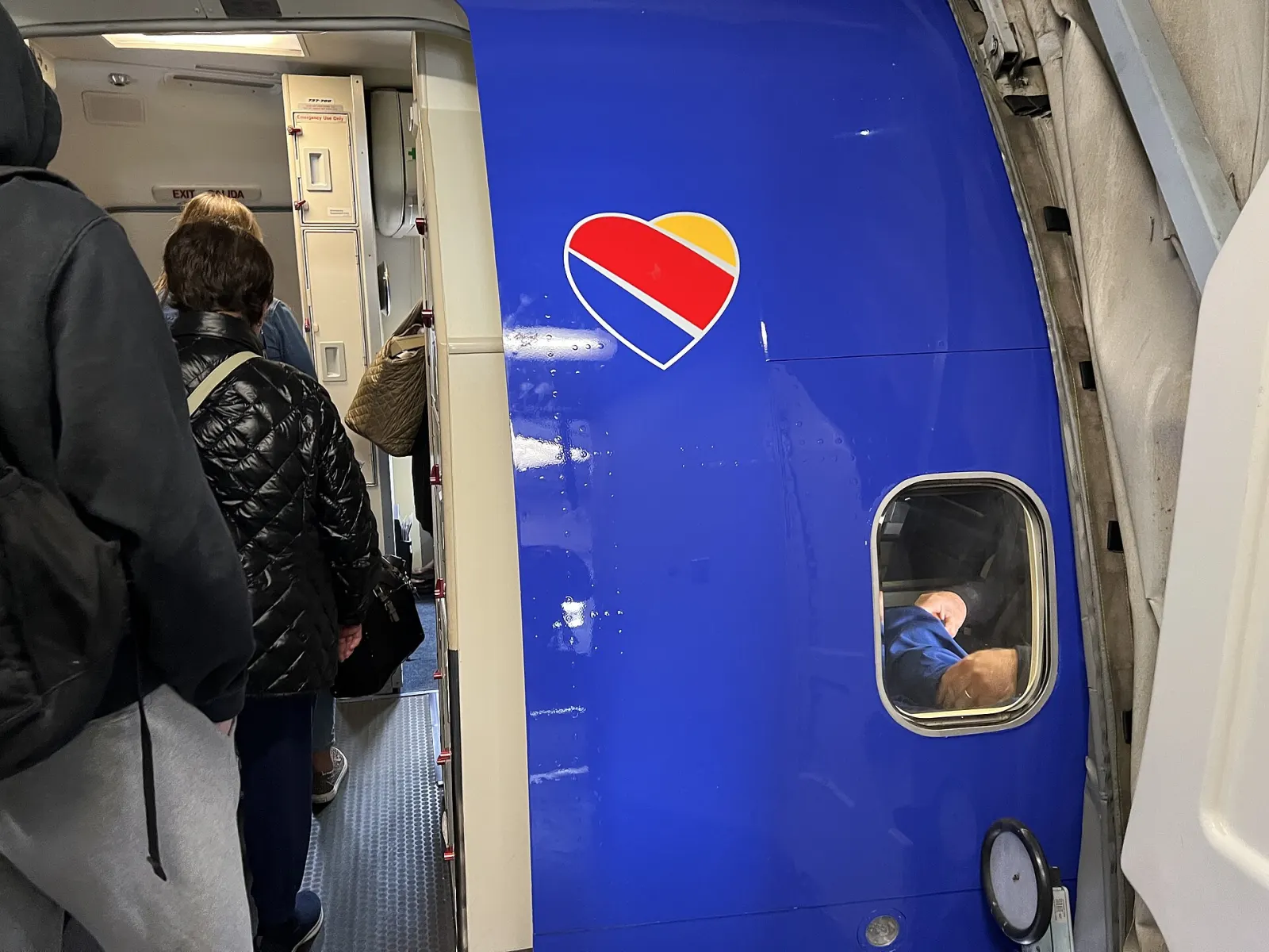 Passengers boarding an aircraft from the gate